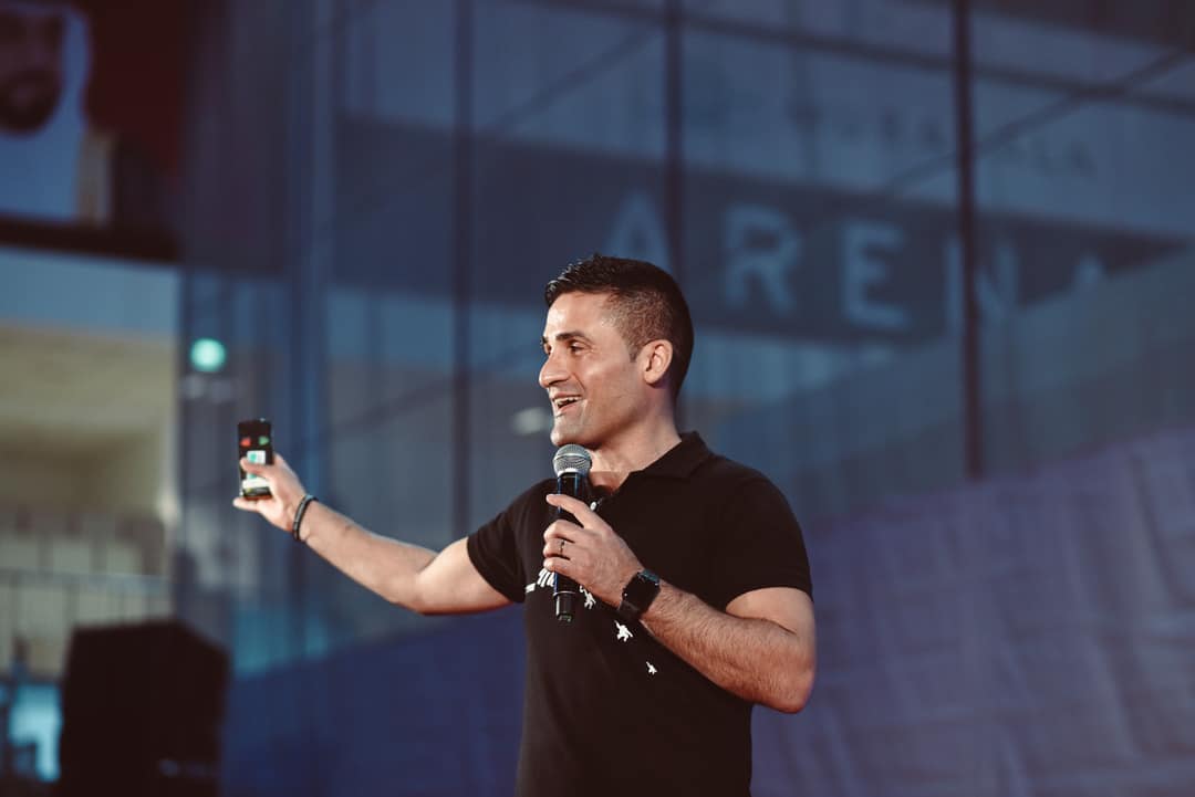 Daniel speaking at a conference